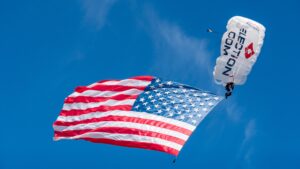 Team Fastrax™ member performs with a 2,000 sq. ft. American Flag.