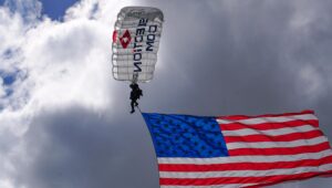 Team Fastrax™ member performs with a 2,000 sq. ft. American Flag.